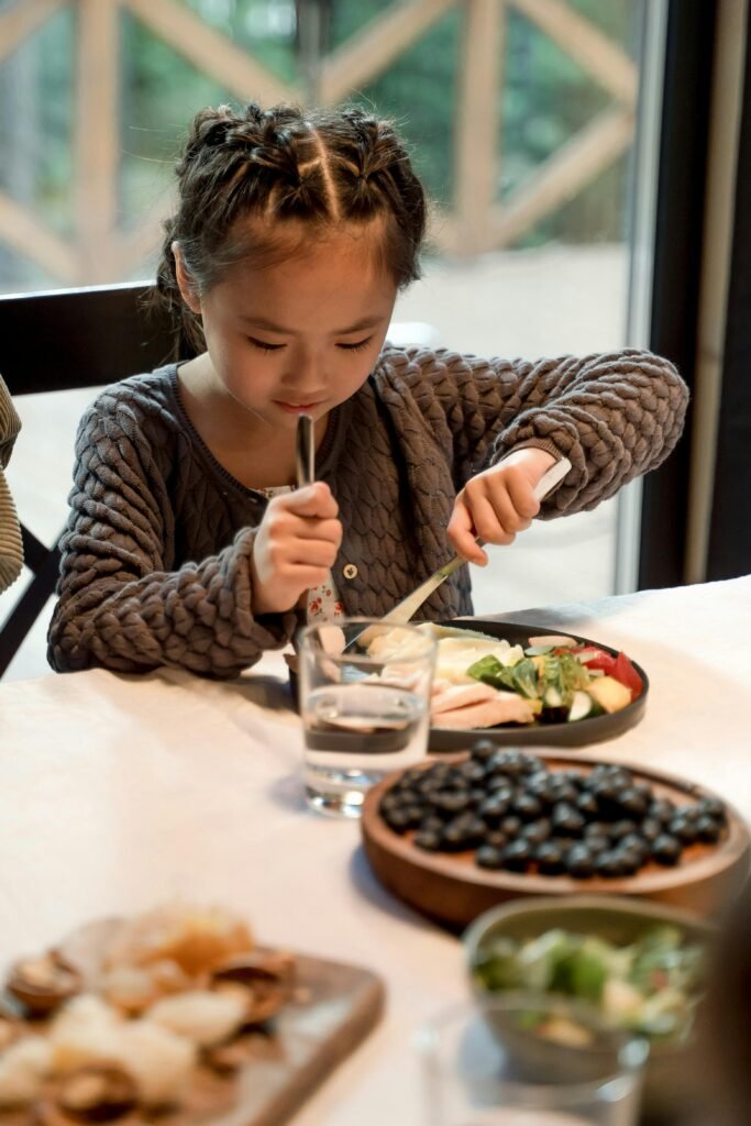 Child eating immune-boosting foods for children’s health during flu season